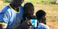 Father-in-Buira-village-in-Musoma-responsively-feeding-his-child-400x533-1-225x300